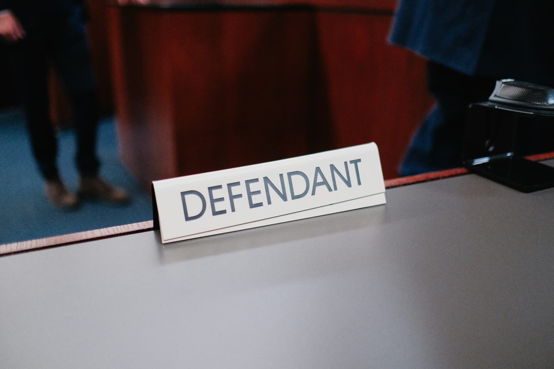 Courtroom defendant nameplate for defense case analysis